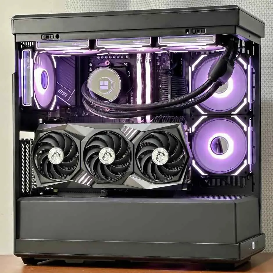 Black HYTE Y40 case with purple-lit fans, an MSI triple-fan RTX 3090, and a Thermalright AIO cooler on an MSI motherboard.
